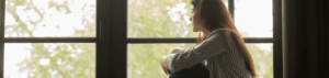 Woman looking at the window