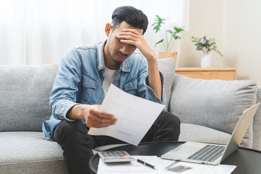 Stressed man with debt